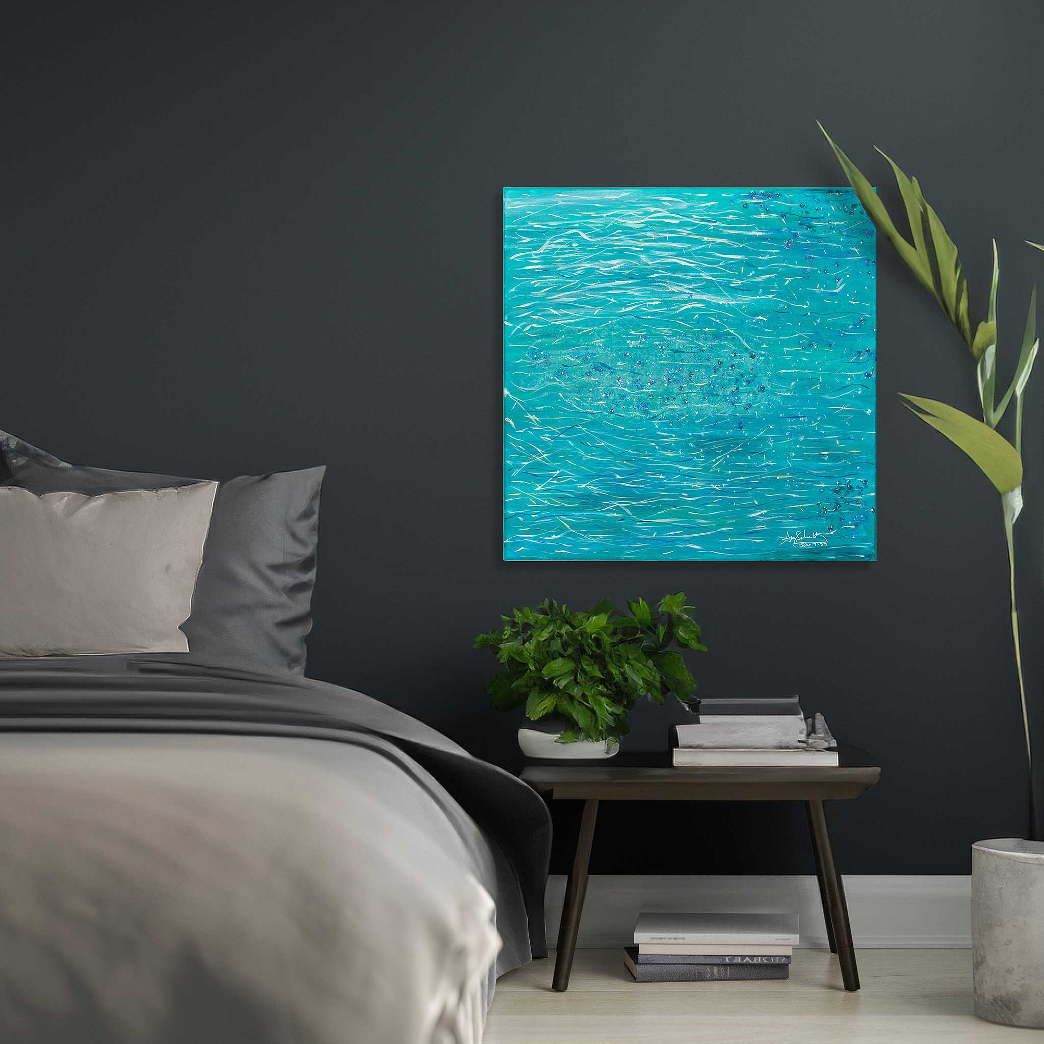 One of Amy's paintings printed and framed, hanging above a nightstand in a bedroom